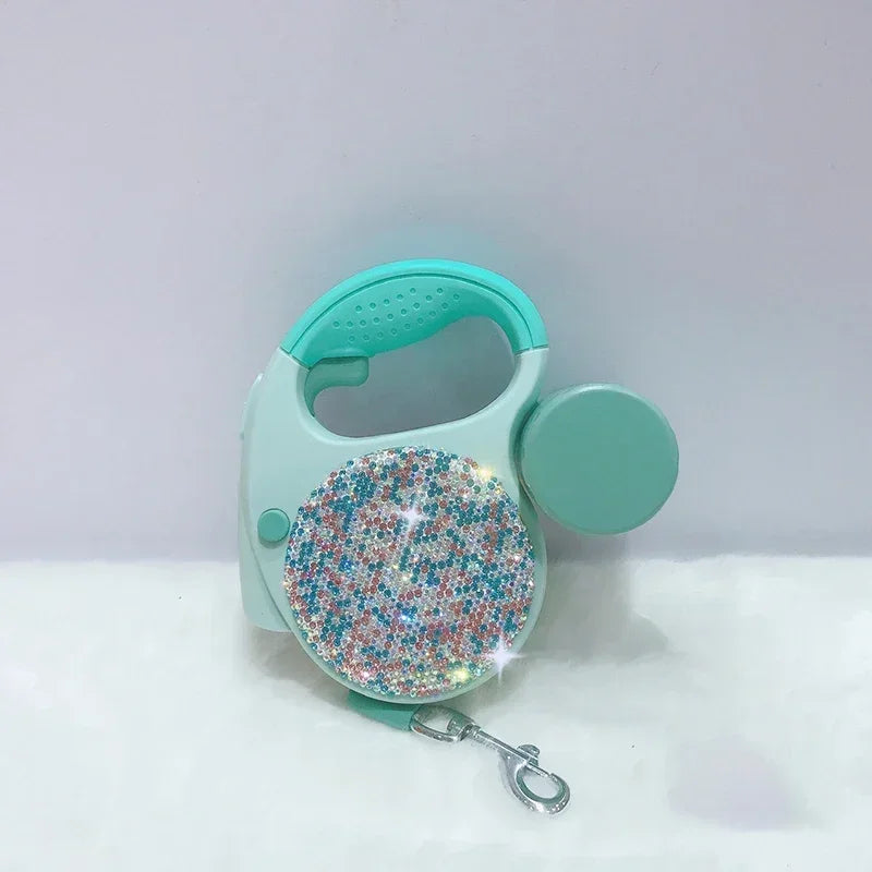 laisse enrouleur paillettes et sac vert